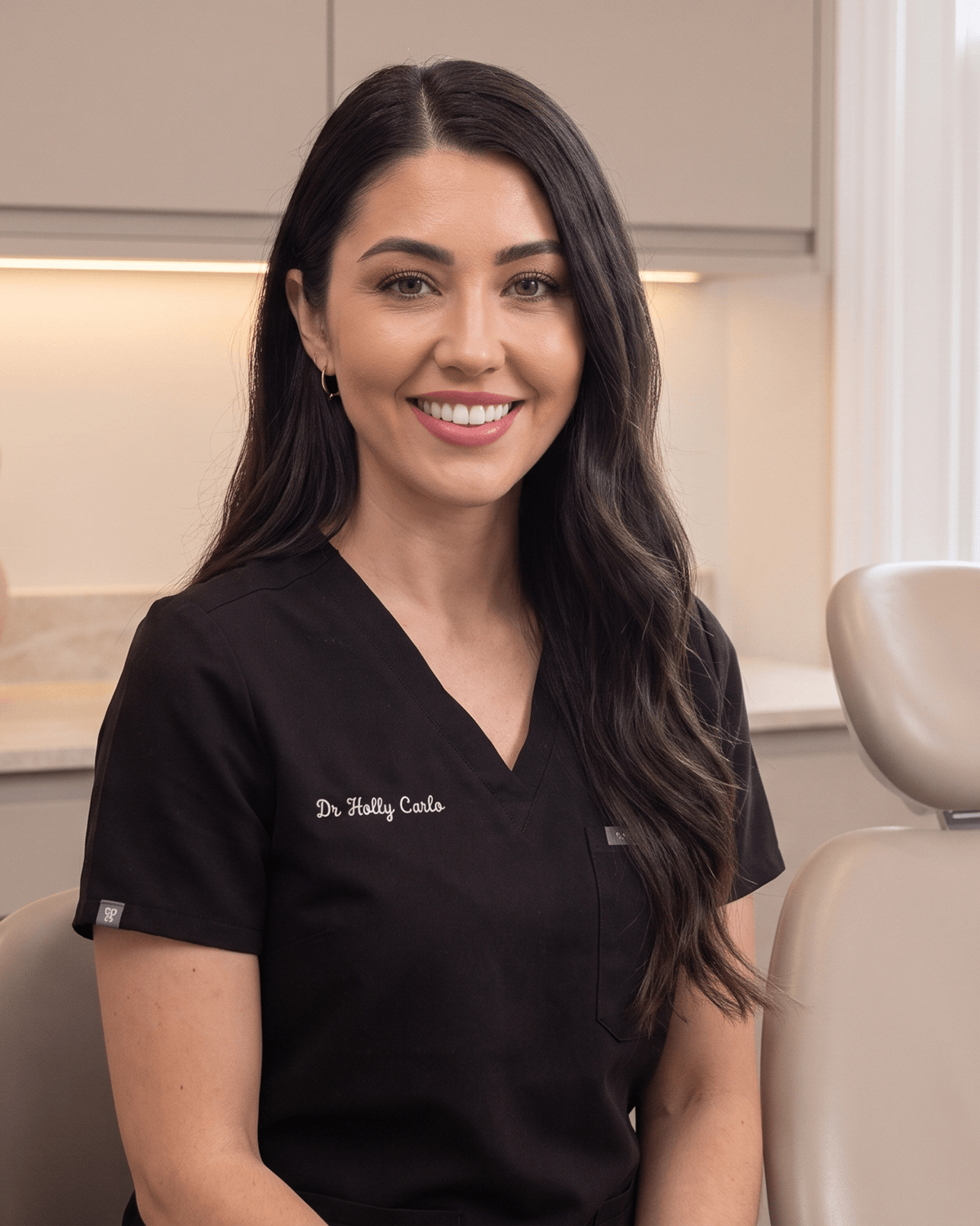 Dr Holly Carlo, seated in the treatment room